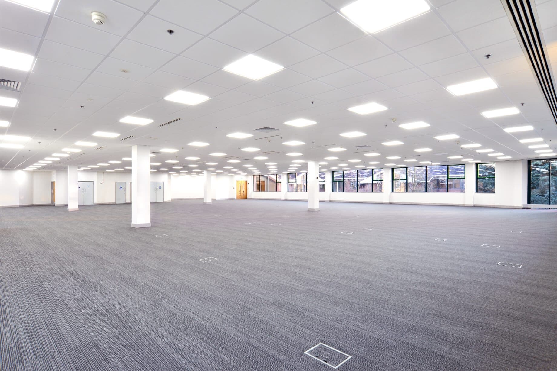 Bright finished commercial interior with ceiling grid